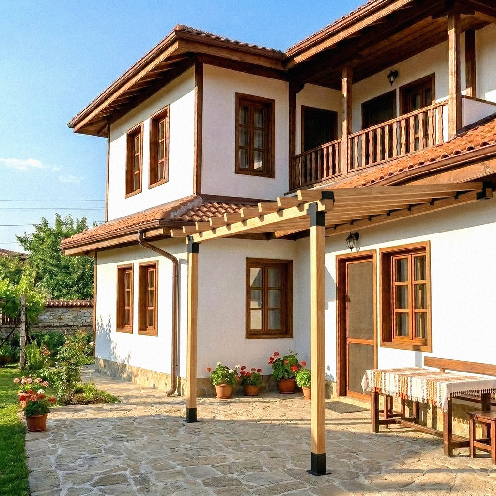 Traditional house with wooden balconies and a stone patio